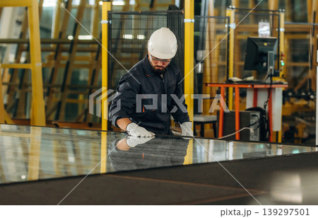 Big storage area, Warehouse worker in an industrial environment of a factory Big storage area, Warehouse worker in an industrial environment of a factory 139297501