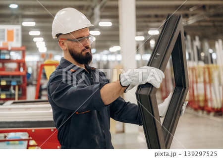 Border for small window, without glass. Warehouse worker in an industrial environment of a factory or storage area Border for small window, without glass. Warehouse worker in an industrial environment of a factory or storage area 139297525