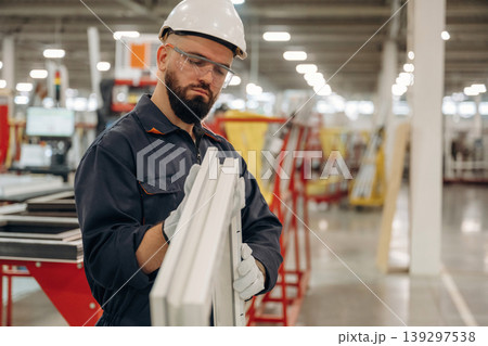 Warehouse worker in an industrial environment of a factory or storage area 139297538