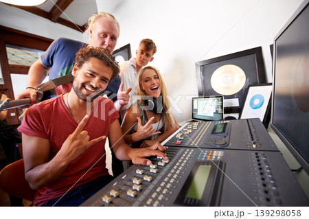 Recording studio, rock sign and portrait of people for music, radio and audio with musical instruments. Hand emoji, soundboard and happy men and women with sound engineer or producer to record media 139298058
