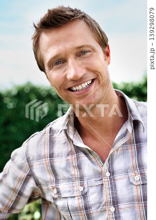 Man, portrait and happy outdoor in garden with confidence, casual style or trendy outfit and blue sky. Person, face and smile in backyard of home with pride, relax and peace on a weekend in nature Man, portrait and happy outdoor in garden with confidence, casual style or trendy outfit and blue sky. Person, face and smile in backyard of home with pride, relax and peace on a weekend in nature 139298079