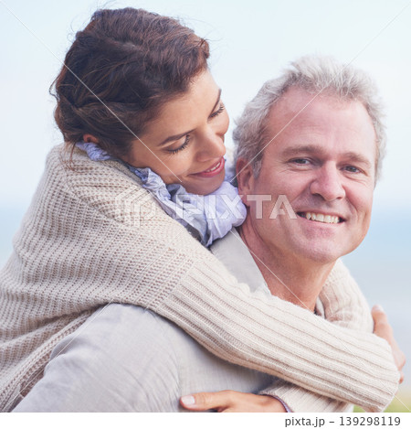 Mature couple, love and piggy back in outdoor, romantic and happiness for holiday fun. Man, woman and bonding together with smile, marriage and commitment with affection, joyful and blue skies 139298119