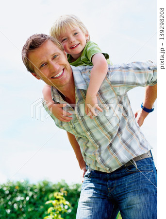 Father, son and portrait outdoor with piggyback for bonding, relationship and freedom in backyard of home. Family, man or boy kid with playing, care and love for happiness, peace or support in garden 139298208