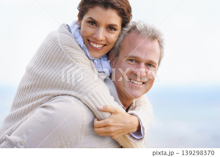 Mature couple, portrait and piggy back on vacation, airplane hands and happiness for holiday. Man, woman and bonding together with smile, marriage and commitment with affection, joyful and blue skies Mature couple, portrait and piggy back on vacation, airplane hands and happiness for holiday. Man, woman and bonding together with smile, marriage and commitment with affection, joyful and blue skies 139298370