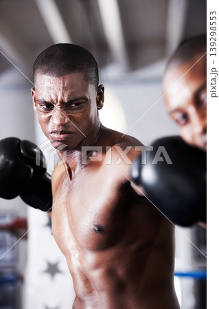 Fight, black man and boxer with hit in ring together for fitness, power strike and training challenge. Strong body, punch in face and fearless athlete in gym with action and confidence in competition Fight, black man and boxer with hit in ring together for fitness, power strike and training challenge. Strong body, punch in face and fearless athlete in gym with action and confidence in competition 139298553