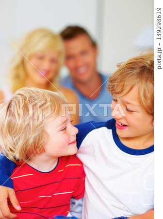 Hug, brothers and love for together on bed, relax wellness and happiness with sibling support in home. Boys, smile or embrace for care, family bonding or proud parents for morning peace in apartment Hug, brothers and love for together on bed, relax wellness and happiness with sibling support in home. Boys, smile or embrace for care, family bonding or proud parents for morning peace in apartment 139298619