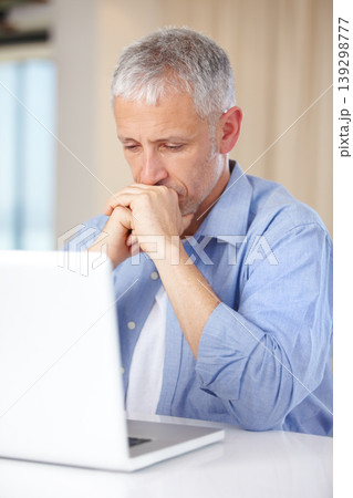 Mature man, laptop and thinking or stress, burnout and anxiety for challenge on technology. Male person, internet and question or doubt for information, brainstorming and online research or planning 139298777