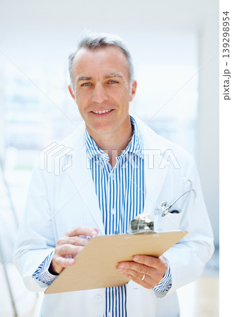 Health, question and portrait of doctor with clipboard, chart or survey for insurance and medical information. Surgeon, man and planning with paperwork, report or checklist at clinic or hospital 139298954