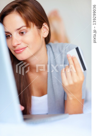 Home, woman and credit card with a laptop, ecommerce and connection with a smile, buying and payment. Person, bedroom or girl with a computer, online shopping and transaction with subscription or app Home, woman and credit card with a laptop, ecommerce and connection with a smile, buying and payment. Person, bedroom or girl with a computer, online shopping and transaction with subscription or app 139299036