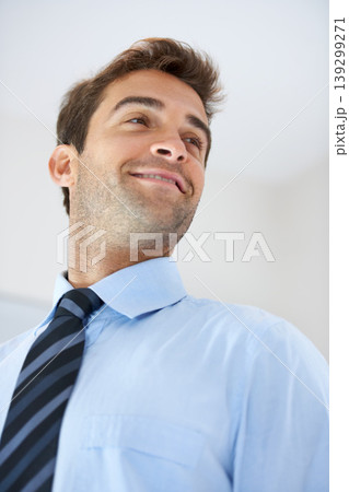 Face, smile or thinking with a business man with a tie in studio on a white background from below. Vision, idea and planning with a happy young employee looking to the future while in his office Face, smile or thinking with a business man with a tie in studio on a white background from below. Vision, idea and planning with a happy young employee looking to the future while in his office 139299271