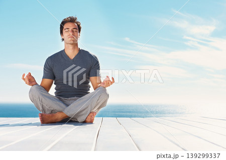 Yoga, blue sky and relax man meditate for spiritual mindset healing, chakra energy balance or outdoor summer freedom. Mockup mindfulness space, beach patio and yogi peace, calm and zen for wellness Yoga, blue sky and relax man meditate for spiritual mindset healing, chakra energy balance or outdoor summer freedom. Mockup mindfulness space, beach patio and yogi peace, calm and zen for wellness 139299337