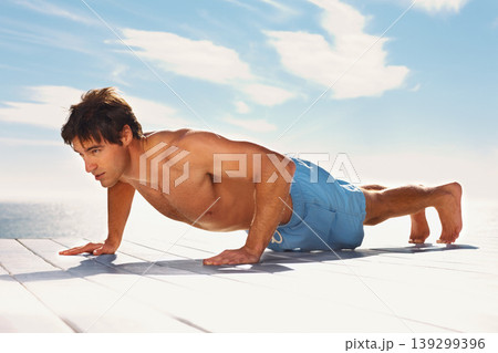 Man, push up and strong with training for health body, fitness and exercise by sky background. Young model, confident and natural glow with wellness and muscle workout outdoor on summer vacation Man, push up and strong with training for health body, fitness and exercise by sky background. Young model, confident and natural glow with wellness and muscle workout outdoor on summer vacation 139299396