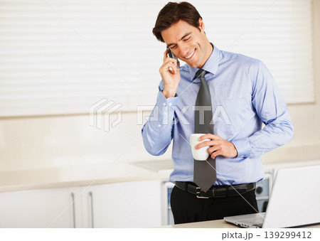 Happy businessman, phone call and laptop with coffee for discussion or communication in kitchen at home. Man or employee talking on mobile smartphone for morning conversation with cup of tea at house Happy businessman, phone call and laptop with coffee for discussion or communication in kitchen at home. Man or employee talking on mobile smartphone for morning conversation with cup of tea at house 139299412