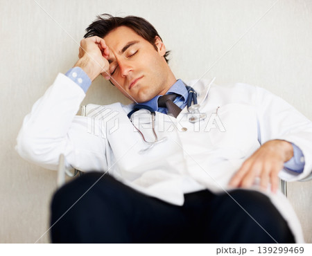 Burnout, tired doctor and sleeping man, health expert or exhausted surgeon dream, rest or nap after cardiology services. Eyes closed, relax medical GP and nurse fatigue in clinic healthcare hospital Burnout, tired doctor and sleeping man, health expert or exhausted surgeon dream, rest or nap after cardiology services. Eyes closed, relax medical GP and nurse fatigue in clinic healthcare hospital 139299469