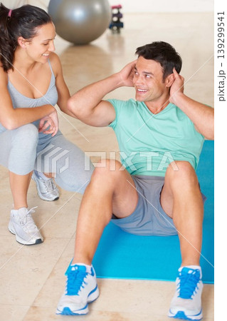 Couple, fitness and man sit up in exercise and workout for health, wellness and cardio together, People, training or woman helping person with core, crunches and pilates routine in gym with happiness 139299541