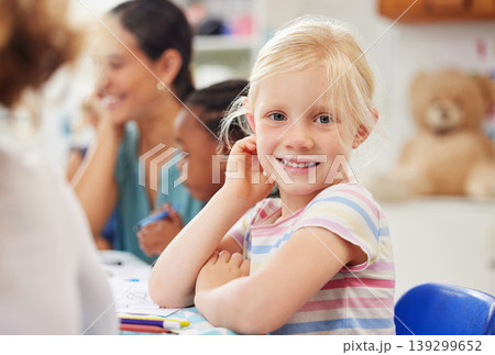Portrait, happy kid or little girl with for learning in kindergarten, daycare or classroom with friends. Youth, looking and smile for growth, future or milestone with education in child development Portrait, happy kid or little girl with for learning in kindergarten, daycare or classroom with friends. Youth, looking and smile for growth, future or milestone with education in child development 139299652