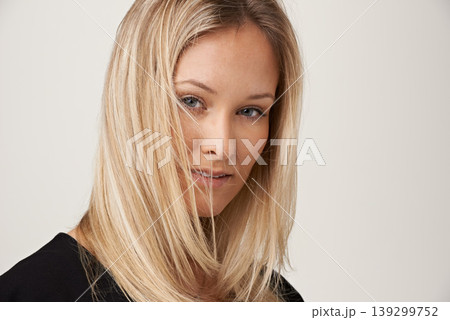 Hair care, beauty and face portrait of a woman on a white background with shampoo, salon treatment and wind. Headshot of female model in studio with cosmetics, hairstyle and happy facial expression Hair care, beauty and face portrait of a woman on a white background with shampoo, salon treatment and wind. Headshot of female model in studio with cosmetics, hairstyle and happy facial expression 139299752