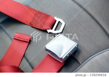 Close up of red aviation seat belt buckle Close up of red aviation seat belt buckle 139299838