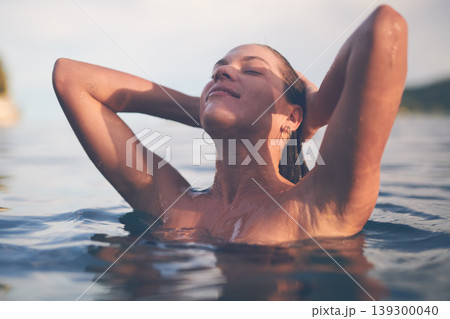 Ocean, swimming and woman with sea, happiness and relax with getaway trip, freedom and outdoor for fun. Person, traveller and girl with holiday, water and summer with weekend break, tourism or travel Ocean, swimming and woman with sea, happiness and relax with getaway trip, freedom and outdoor for fun. Person, traveller and girl with holiday, water and summer with weekend break, tourism or travel 139300040