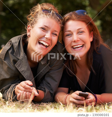 Portrait, outdoor and women on the grass with smile, funny or happiness with vacation, relax or bonding together. Face, people on the ground or girls with joy, weekend break or getaway with summer Portrait, outdoor and women on the grass with smile, funny or happiness with vacation, relax or bonding together. Face, people on the ground or girls with joy, weekend break or getaway with summer 139300101