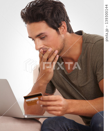 Man, stress and credit card on laptop for home online shopping, e commerce mistake or payment error. Shocked person check wrong balance, phishing warning and cybersecurity risk of banking on computer Man, stress and credit card on laptop for home online shopping, e commerce mistake or payment error. Shocked person check wrong balance, phishing warning and cybersecurity risk of banking on computer 139300144