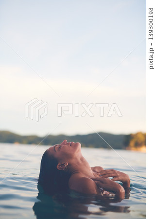 Ocean, swimming and woman with vacation, sea and relax with getaway trip, freedom and outdoor for fun. Person, traveller and girl with holiday, water and summer with weekend break, carefree or travel Ocean, swimming and woman with vacation, sea and relax with getaway trip, freedom and outdoor for fun. Person, traveller and girl with holiday, water and summer with weekend break, carefree or travel 139300198
