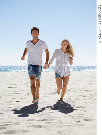 Love, holding hands and happy couple running on beach for date, outdoor bonding and tropical holiday. Romance, man and woman at sea, fun and relax on vacation together with travel, care and adventure Love, holding hands and happy couple running on beach for date, outdoor bonding and tropical holiday. Romance, man and woman at sea, fun and relax on vacation together with travel, care and adventure 139300325