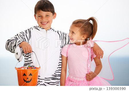 Family, children and siblings with halloween, costume or hug outdoor with love, care or fun together. Happy, smile and kids in character for festival, holiday or fantasy, playing or bond with freedom Family, children and siblings with halloween, costume or hug outdoor with love, care or fun together. Happy, smile and kids in character for festival, holiday or fantasy, playing or bond with freedom 139300390