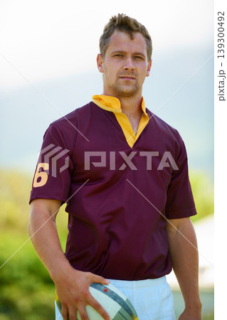 Portrait, ball and a man rugby player outdoor for sports, fitness or training at a club in uniform. Health, exercise and a strong youth athlete on a field for a workout to improve skill or technique 139300492