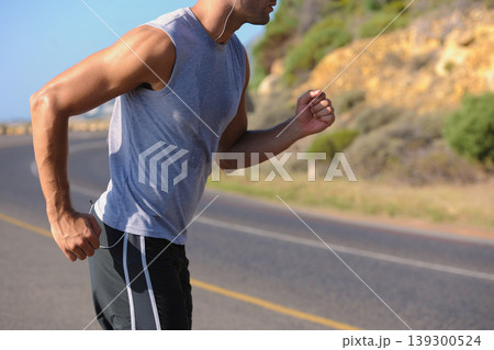 Fitness, sweat and man athlete in mountain running for race, marathon or competition training. Sports, workout and body of male runner doing a cardio exercise for health or wellness in outdoor nature 139300524