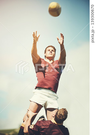Rugby, sports and teamwork and man and ball on field for training, health and stadium practice. Challenge, competition and performance with male person in outdoor pitch for exercise, game and workout Rugby, sports and teamwork and man and ball on field for training, health and stadium practice. Challenge, competition and performance with male person in outdoor pitch for exercise, game and workout 139300670