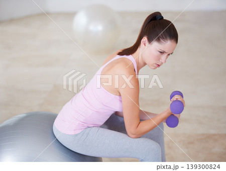 Dumbbells, woman and fitness with workout, health and wellness studio with gym equipment, sports and exercise ball. Person, challenge and girl with progress, hardcore and endurance with energy Dumbbells, woman and fitness with workout, health and wellness studio with gym equipment, sports and exercise ball. Person, challenge and girl with progress, hardcore and endurance with energy 139300824