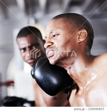 Fight, black man and boxer with punch in ring together for fitness, power strike and training challenge. Strong body, hit in face and fearless athlete in gym with action and confidence in competition Fight, black man and boxer with punch in ring together for fitness, power strike and training challenge. Strong body, hit in face and fearless athlete in gym with action and confidence in competition 139300857