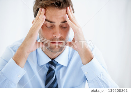Business man, headache and stress or angry for bankruptcy, stock market crash or financial fail in office, wall or white background. Tired or frustrated person or mature boss with debt and job crisis Business man, headache and stress or angry for bankruptcy, stock market crash or financial fail in office, wall or white background. Tired or frustrated person or mature boss with debt and job crisis 139300861
