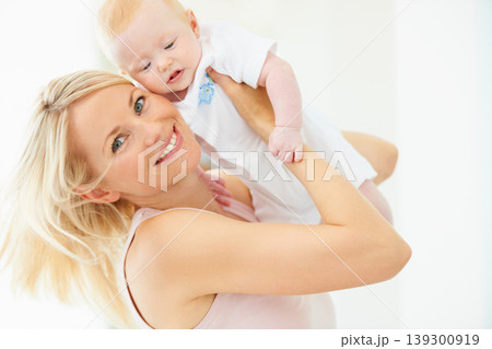 Mother, baby and smile for play, lift and child development or love, security and bonding in portrait. Mom, daughter and connection or fun, joy and care in motherhood, happiness and airplane game Mother, baby and smile for play, lift and child development or love, security and bonding in portrait. Mom, daughter and connection or fun, joy and care in motherhood, happiness and airplane game 139300919