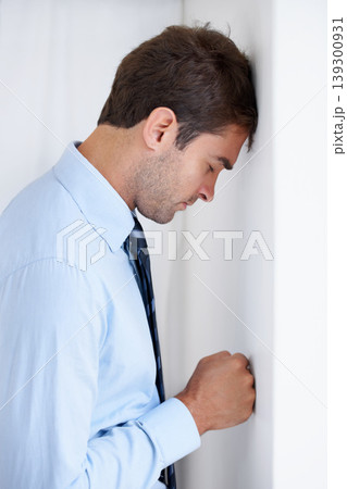 Frustrated businessman, stress and mistake in anger, anxiety or burnout with fist on wall at office. Upset man or employee in financial crisis, depression or mental health problems at workplace 139300931