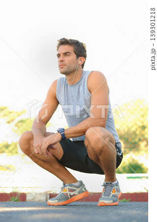 Sports, break and man athlete in nature with earphones training for race, marathon or competition. Fitness, exercise and young male runner listening to podcast, radio or playlist for cardio workout. 139301218