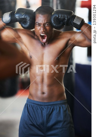 Boxing, gloves and portrait of black man shouting in gym with fitness, power and training challenge. Strong body, muscle and boxer in club, athlete with motivation and confidence in competition fight 139301294