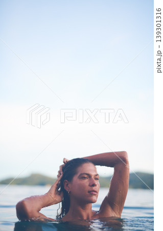 Ocean, swimming and woman with sea, travel and relax with getaway trip, freedom and outdoor for vacation. Person, tourism or girl with holiday, water and summer with weekend break, carefree or travel Ocean, swimming and woman with sea, travel and relax with getaway trip, freedom and outdoor for vacation. Person, tourism or girl with holiday, water and summer with weekend break, carefree or travel 139301316