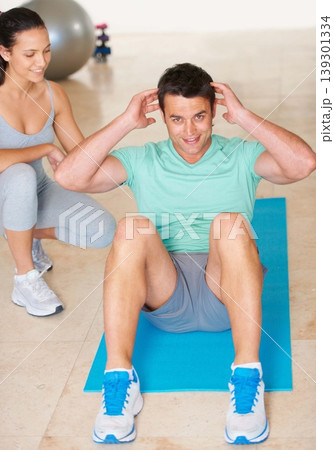 Personal trainer, fitness and portrait of man sit up in exercise and workout for health, wellness and cardio, People, training or coach helping person with core, crunches and pilates routine in gym Personal trainer, fitness and portrait of man sit up in exercise and workout for health, wellness and cardio, People, training or coach helping person with core, crunches and pilates routine in gym 139301334