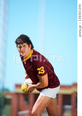 Fitness, man and sports with rugby, ball or pass at a field for training, match or hobby outdoor. Football, face and male athlete at a park for game day, performance or workout, skill or practice Fitness, man and sports with rugby, ball or pass at a field for training, match or hobby outdoor. Football, face and male athlete at a park for game day, performance or workout, skill or practice 139301345