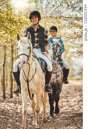 Portrait, women and horses in a forest, happiness and woods with animal care, stallion and countryside. Adventure, pets and girls with joy, activity and relax with hobby, bonding together and friends 139301454