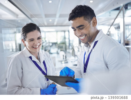 Tablet, scientist and happy in laboratory for healthcare, gloves and medical research for vaccine cure. Woman, man and diversity by touchscreen and pharmaceutical analysis with science collaboration Tablet, scientist and happy in laboratory for healthcare, gloves and medical research for vaccine cure. Woman, man and diversity by touchscreen and pharmaceutical analysis with science collaboration 139301688