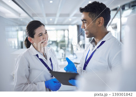 Happy people, scientist and tablet in team research, collaboration or planning together at lab. Man and woman smile with technology for science discovery, search or teamwork at hospital or laboratory Happy people, scientist and tablet in team research, collaboration or planning together at lab. Man and woman smile with technology for science discovery, search or teamwork at hospital or laboratory 139301842