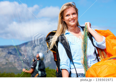 Paragliding, parachute or woman in nature for sport, smile or strings for exercise for health support. Athlete, happy or training with fitness for outdoor wellness, helmet or equipment in countryside 139301971