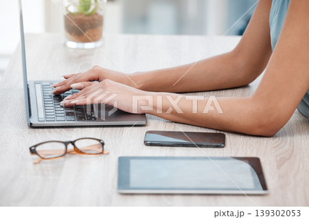 Hands, laptop and a business woman at a desk in her office for communication, networking or report. Phone, tablet and glasses with an employee typing an email closeup in a professional workplace Hands, laptop and a business woman at a desk in her office for communication, networking or report. Phone, tablet and glasses with an employee typing an email closeup in a professional workplace 139302053