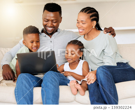 Sofa, black family and happy with laptop for movie streaming at home to relax and bond. Smile, couch and mother, father and children browsing on a computer for a film subscription on the internet Sofa, black family and happy with laptop for movie streaming at home to relax and bond. Smile, couch and mother, father and children browsing on a computer for a film subscription on the internet 139302224