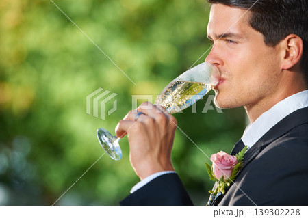 Wedding, nature and groom drinking champagne for romantic celebration, party or event. Garden, alcohol and young man in a suit with sparkling wine at luxury, elegant and fancy marriage ceremony. 139302228