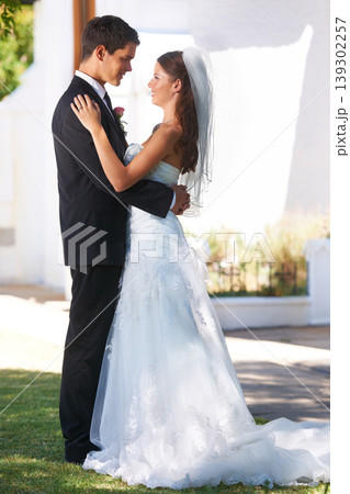 Happy couple, wedding and hug or dancing at outdoor ceremony, reception or honeymoon together. Man or groom holding woman or bride smile for embrace, support or love in commitment or trust in garden Happy couple, wedding and hug or dancing at outdoor ceremony, reception or honeymoon together. Man or groom holding woman or bride smile for embrace, support or love in commitment or trust in garden 139302257