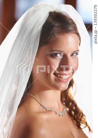 Bride, portrait and smile for love, wedding commitment and celebration ceremony with a veil. Jewelry, woman and happy from future marriage, romance and formal event in a church with a bridal dress Bride, portrait and smile for love, wedding commitment and celebration ceremony with a veil. Jewelry, woman and happy from future marriage, romance and formal event in a church with a bridal dress 139302276